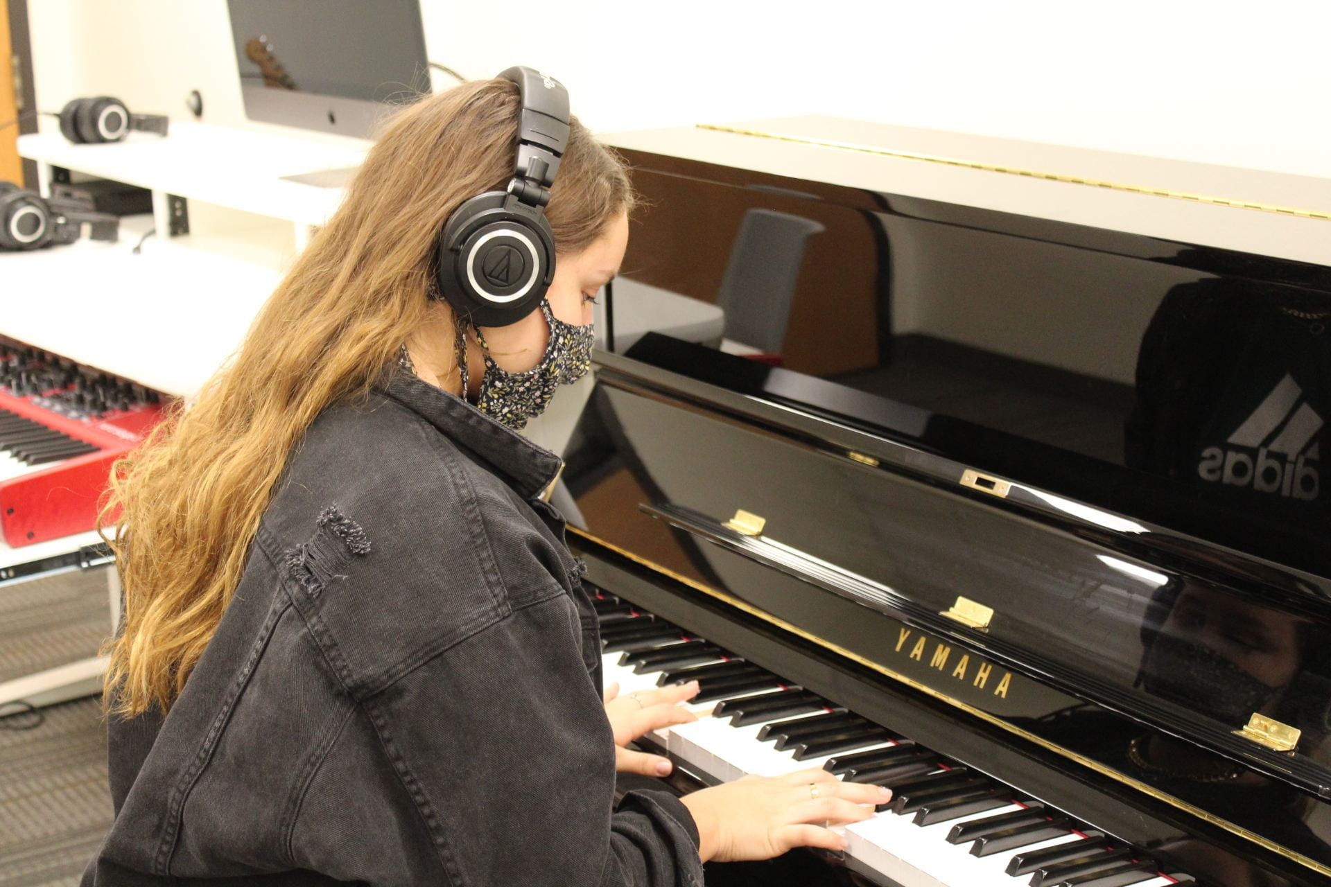 girl playing Yamaha silent piano