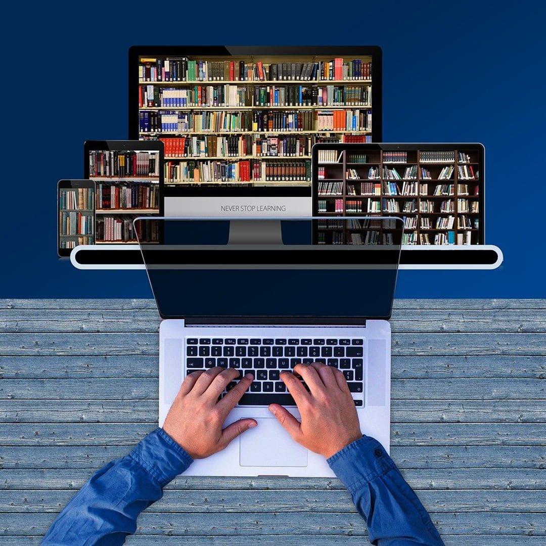 Laptop illustration with library shelves in the background